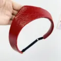 Close-up of red leather crown headband with textured finish and adjustable strap - Adjustable Size / Red