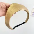 Close-up of golden faux leather padded headband with adjustable black elastic strap - Adjustable Size / Golden Yellow