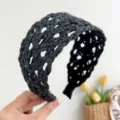 Close-up detail of a stylish black woven rattan wide headband for summer vacation - Braided Headband / Black