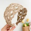 Close-up detail of khaki woven straw wide headband with decorative open-weave boho design - Braided Headband / Khaki