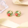 Detailed close-up of Chinese style enamel floral stud earrings featuring delicate pearls. - Green Plum Blossom Enamel Stud Earrings (2-27174-7800)
