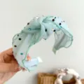Detailed view of mint green mesh knotted headband with sparkling colorful rhinestones - Light Green Mesh Rhinestone Headband (S217)
