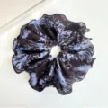 Close-up view of a blue and brown tie-dye fabric scrunchie featuring elegant ruffled edges - Large Scrunchie (S262) / Blue Tie-dye