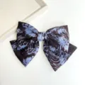 Detail view of a large tie-dye fabric bow hair clip with elegant blue and brown patterns - Bowknot Spring Clip (S262) / Blue Tie Dye