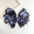 Detail view of large blue tie-dye fabric bow hair clip with sparkling rhinestone center. - Rhinestone Bowknot Spring Clip (S262) / Blue Tie Dye
