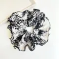 Detailed view of black and white tie-dye ruffled fabric scrunchie with ink splash pattern - Black and White Tie-Dye Large Scrunchie