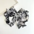 Detailed view of black and white tie-dye fabric bow hair clip with rhinestone center - Rhinestone Bow Clip / Black and White Tie-Dye Rhinestone Bow Clip