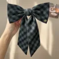 Close-up detail of vintage grey plaid bow hair clip featuring a gold metal letter M - Bow Streamer Hair Clip (S444)