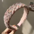 Close-up detail of a colorful braided woolen headband showing high-quality yarn texture - Knitted Headband / Pink
