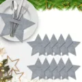 Grey star-shaped felt cutlery holders displayed on a white plate with Christmas decor. - Pentagram / 12-Piece Set / Gray