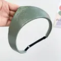 Detailed view of sage green textured leather crown headband with adjustable strap. - Adjustable Size / Green