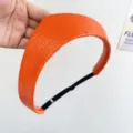 Close-up of orange leather crown headband with textured finish and adjustable strap - Adjustable Size / Orange