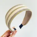 Detailed view of cream headband with gold chain and sparkling silver rhinestone rows - Wide Side Style / Beige