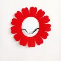 Flat view of a red felt sunflower headpiece with a black elastic strap for performance - S / Red