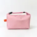 Pink portable insulated lunch bag with buckle handle and waterproof fabric for daily use. - Pink