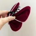 Close-up of velvet butterfly hair claw clip in wine red with delicate white border - Butterfly Style (S378) / White Border Wine Red