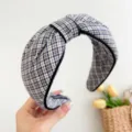 Detailed view of a stylish blue and white plaid knotted headband hair accessory. - Ribbon Edged / Black And White Plaid Wrapped Edge Headband