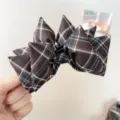 Close-up detail of a vintage brown plaid bow hair clip for elegant autumn hairstyles - Bow Banana Clip (S397) / Chocolate Plaid
