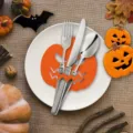 Festive Halloween pumpkin felt cutlery holder on a white plate with fall table decor - Pumpkin Shape