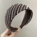 Detailed close-up of a wide brown headband with elegant sequined and embroidered stripes. - Wide Headband / Coffee Sequins