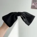 Elegant large black satin 3D bow hair clip featuring a delicate gold heart charm - Bow Spring Clip / Black