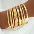 Set of multiple gold-textured bangles showing diverse patterns and luxury finish - 10-Piece Set - Simple Texture (6574101HB) / Gold