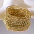 Pila de pulseras de cuentas doradas de varias capas con acabado de espejo pulido - Pulsera de Cuentas Pulidas Multicapa Dorado(5846001HB)
