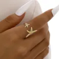 Eleganter verstellbarer goldener Seestern Ring für Damen Strandurlaub Schmuckstück - Doppelter Seestern Offener Stil (6509401) / Gold
