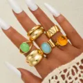 Detailed macro shot of vintage gold alloy chunky rings featuring colorful faux gemstones - Six-Piece Colorful Stone Bohemian Style (6572201HB)