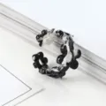 Eleganter Gelenkring aus Kunstharz mit schwarz-weißem Marmormuster und feinem Blumendesign - Einheitsgröße / Blumen Schwarz Weiß Muster (5409205)