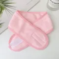 Detailed macro view of a soft pink spa headband with an adjustable white velcro closure - Pink (3013)