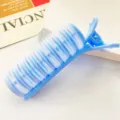 Close-up of blue plastic volumizing hair roller clip with velcro-style texture - Blue (3791)