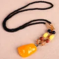 Sautoir de style ethnique vintage avec pendentif en imitation ambre et perles noires - F0174 Style de Contentement