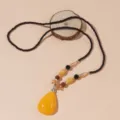 Sautoir ethnique vintage avec pendentif goutte d'eau en imitation cire d'abeille - F0200 Style Goutte