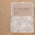 Set of clear disposable elastic hair rubber bands in a convenient plastic storage box - Boxed Style / Clear