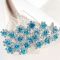 Set of elegant U-shaped hair pins featuring blue crystal roses and sparkling rhinestones. - Rose Flower U-Shaped Hair Pin / 20 Piece Set / Lake Blue