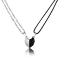 Detail view of magnetic split heart pendants for couples in silver and black finish - 5301101 (Black And Silver Heart Set)