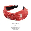 Festive Christmas red fabric knotted headband with reindeer and snowflake patterns - Red