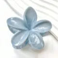 Detailed macro view showing the elegant marble texture on a light blue frangipani hair claw clip. - Cloud Texture Flower Style (3577-1) / Landscape Blue