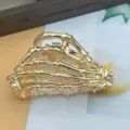 Gold skeleton hand metal hair claw clip with gothic punk design for Halloween. - Ghost Claw / Gold