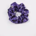 Halloween themed purple fabric scrunchie with spooky white skull and black bat prints - Purple