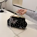 Elegant retro black velvet dinner clutch bag featuring embroidered butterfly and pearl bead details - Black