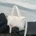 Stylish white puffy quilted nylon crossbody bag with wide strap, 2025 collection. - White