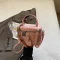 Fashionable pink box-shaped handbag with top handle and crossbody strap - With Pendant / Pink