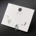 Elegantes silbernes Ohrring-Set mit Stern und Herz, blauen Zirkon-Akzenten und Ketten - Blaues Himmlisches Geometrie Set (5796301)