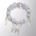 Elegant lavender glass beaded bracelet featuring a butterfly charm and silver feather accents. - Niche Luxury Style (6107801) / Lavender