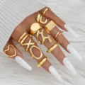 12-delige set gouden geometrische ringen met minimalistische onregelmatige hartvormen. - Geometrische 12-delige set (6233901)