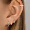 Elegante juego de 4 pendientes de aro y manguito con cristales pavé en color plateado - Estilo de hebilla y manguito de oreja plateados con diamantes de imitación de 4 piezas (5804702HB) / 8.69
