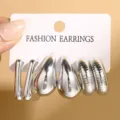 Lot de 3 paires de boucles d'oreilles géométriques argentées en forme de goutte et C pour femme. - Lot de 3 Paires de Boucles d'Oreilles Géométriques Argentées Effet Miroir (6464001) / Argent