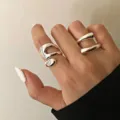Modern minimalist irregular metallic open rings in silver finish shown on female hand model - Silver Simple Double Layer (5874001)